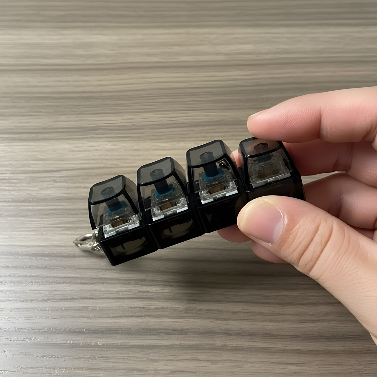 Clixie Keystack fidget keychain with mechanical switches and LED glow for stress relief