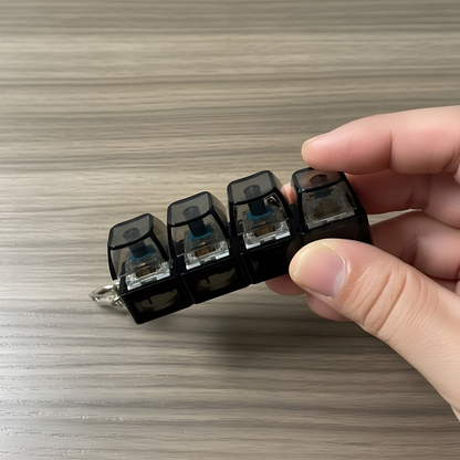 Clixie Keystack fidget keychain with mechanical switches and LED glow for stress relief